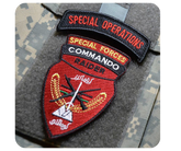Custom embroidered Velcro patch attached to military uniform using hook and loop backing — reusable and durable design by Embrolab.