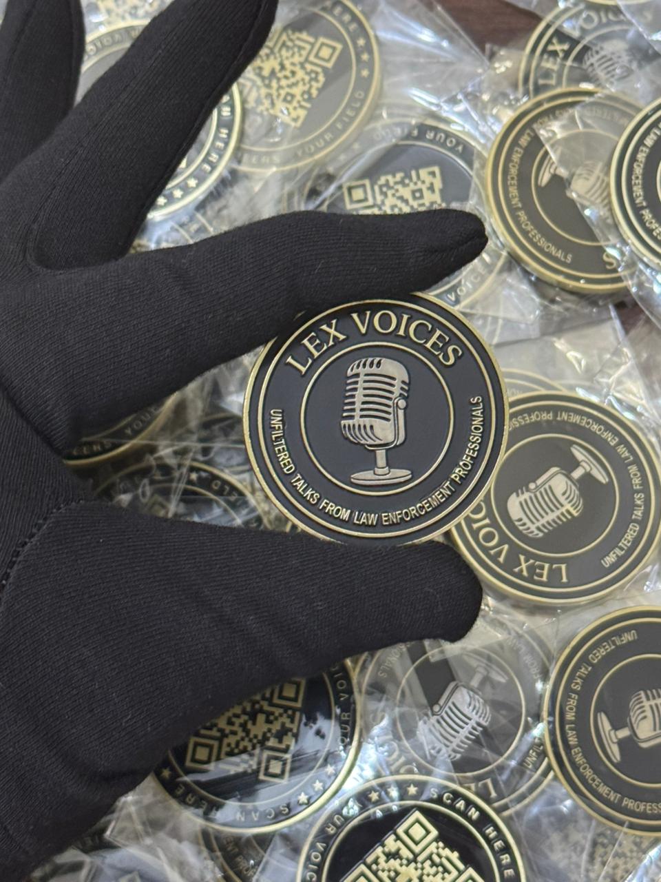 Custom brand challenge coin for Lex Voices featuring microphone logo and gold-plated finish. Ideal for branded corporate coins, award coins, and collector challenge coins.