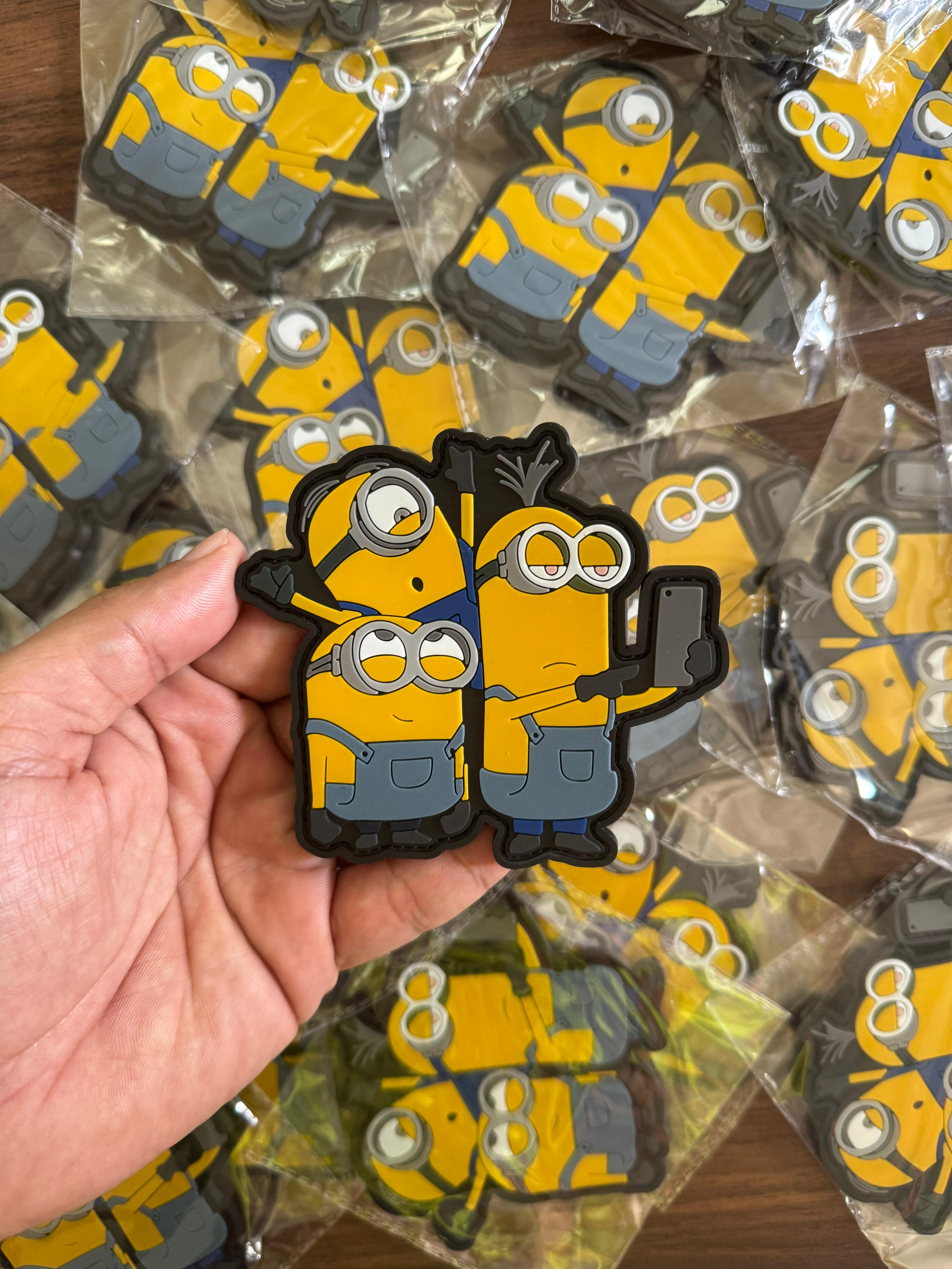 Fun custom PVC patch with Minions selfie design, durable rubber patch for clothing, backpacks, and accessories.