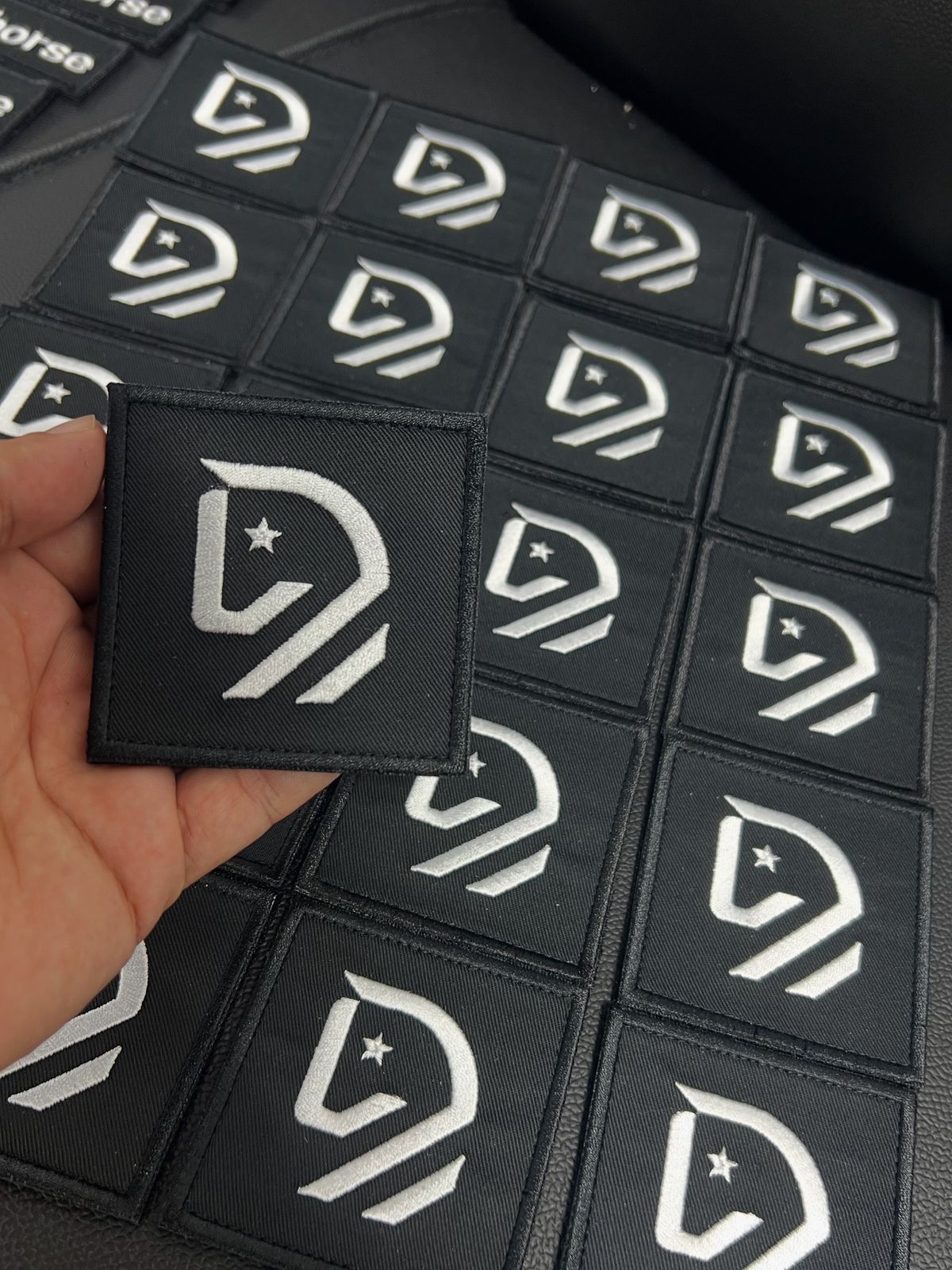 Custom embroidered patches square logo badge, premium logo embroidery patches manufactured in Dubai for branding and embroidery patches for clothes.