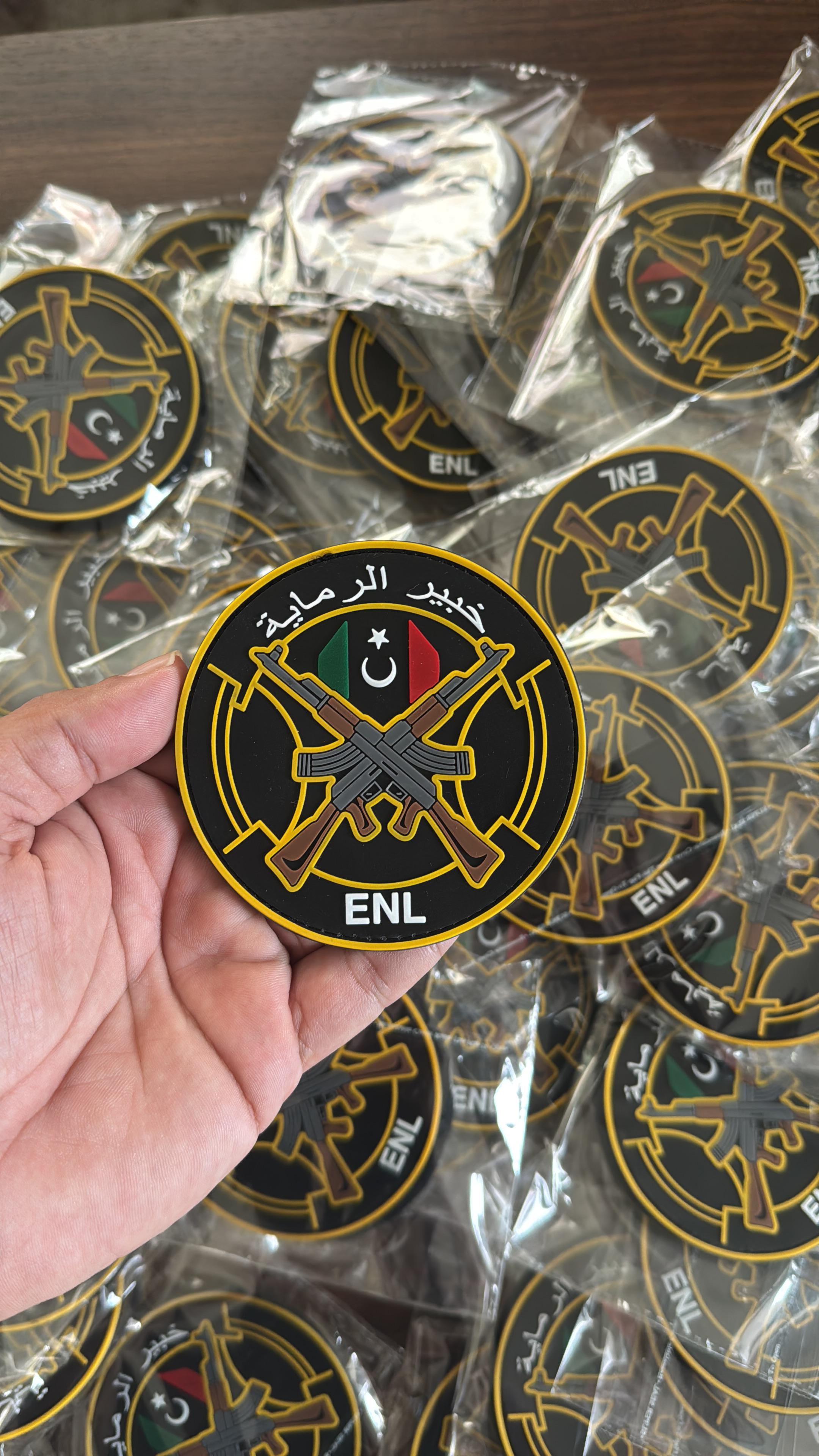 High-quality custom PVC patch for ENL with crossed rifles and Libyan flag design, durable rubber patch for uniforms and tactical gear.