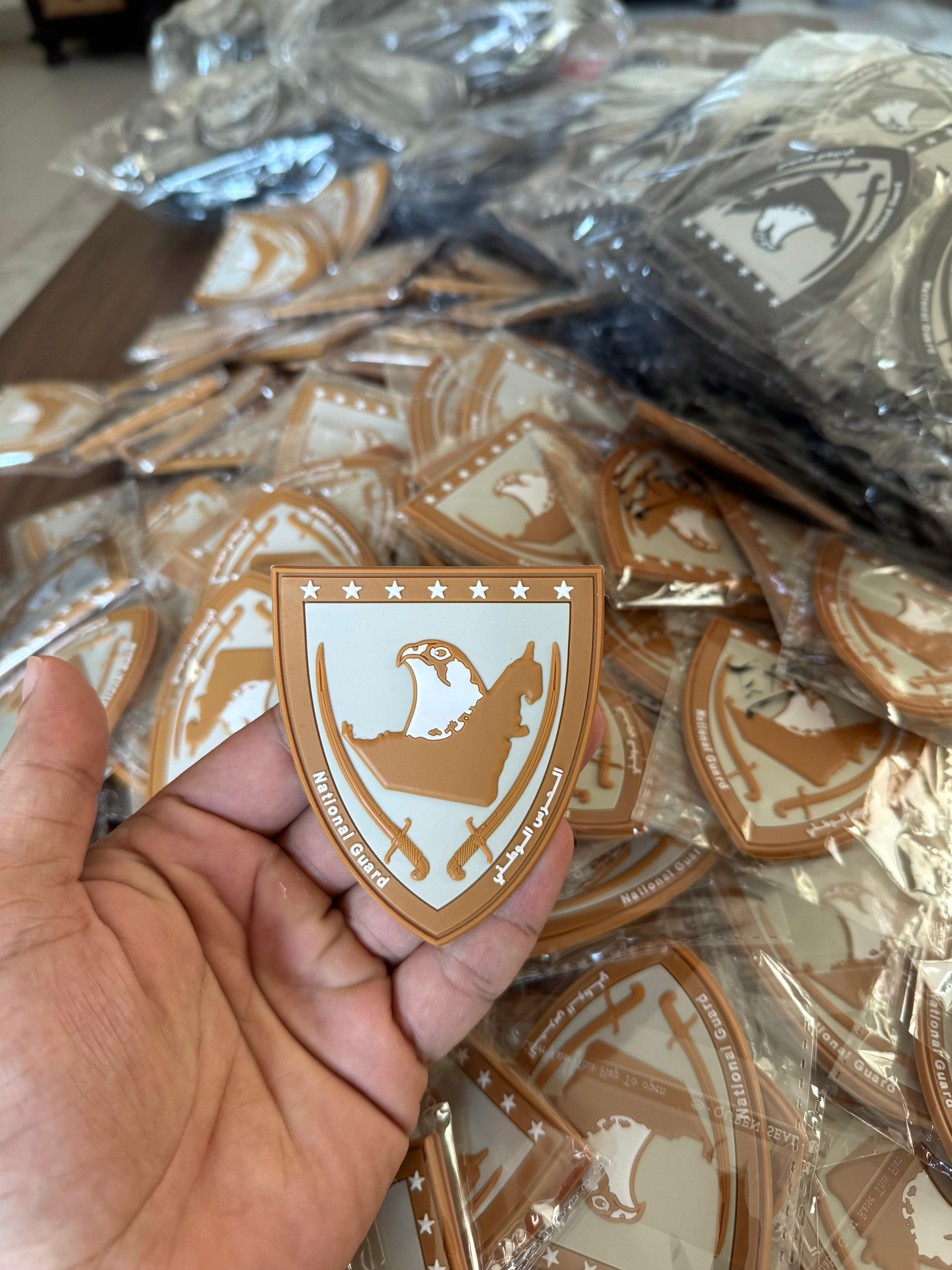 Custom PVC patch for National Guard with eagle emblem, shield design, and Arabic script, durable rubber patch for military uniforms.