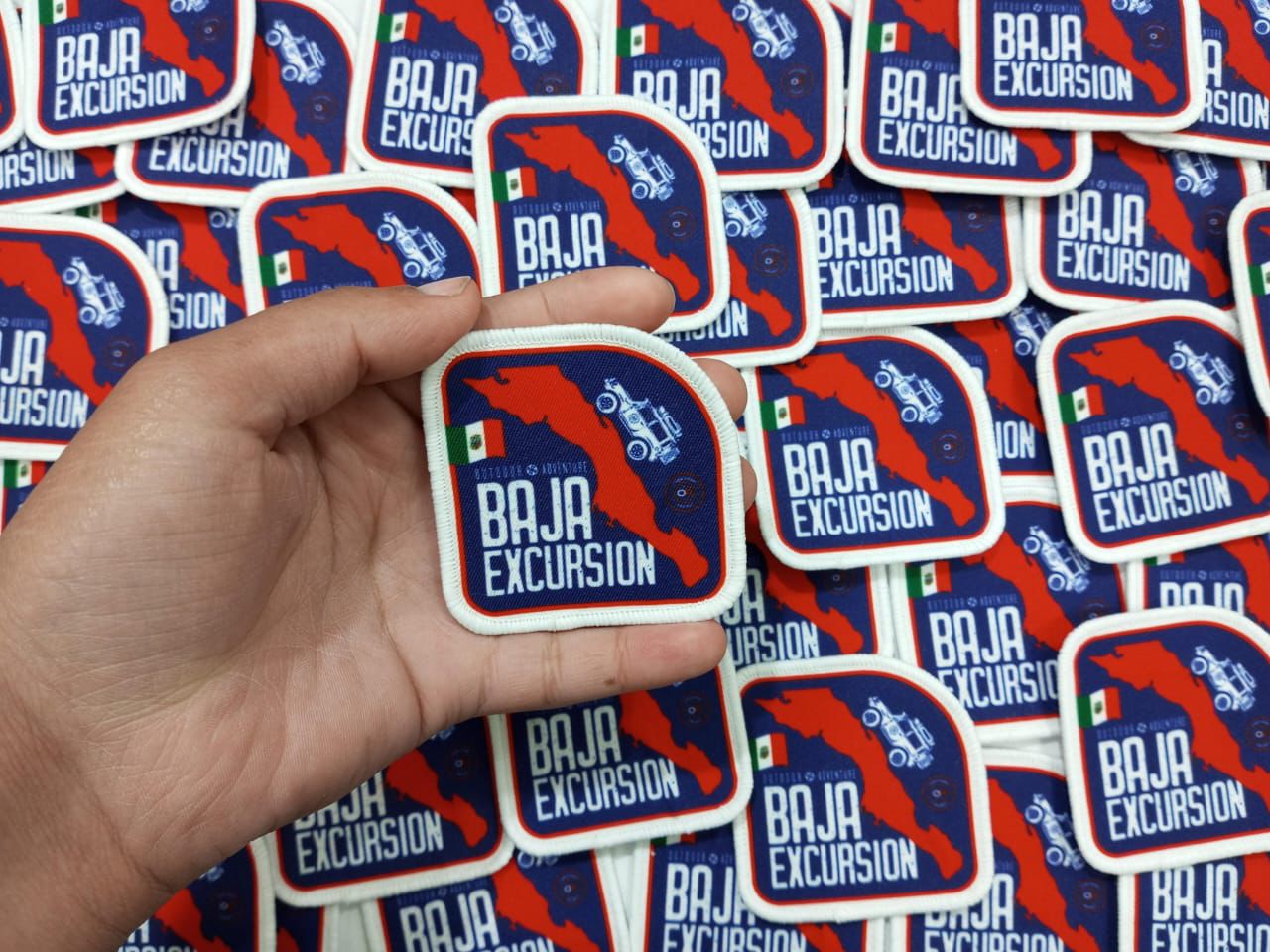 High-quality custom printed patch with Baja Excursion map and logo, perfect for events and branding.