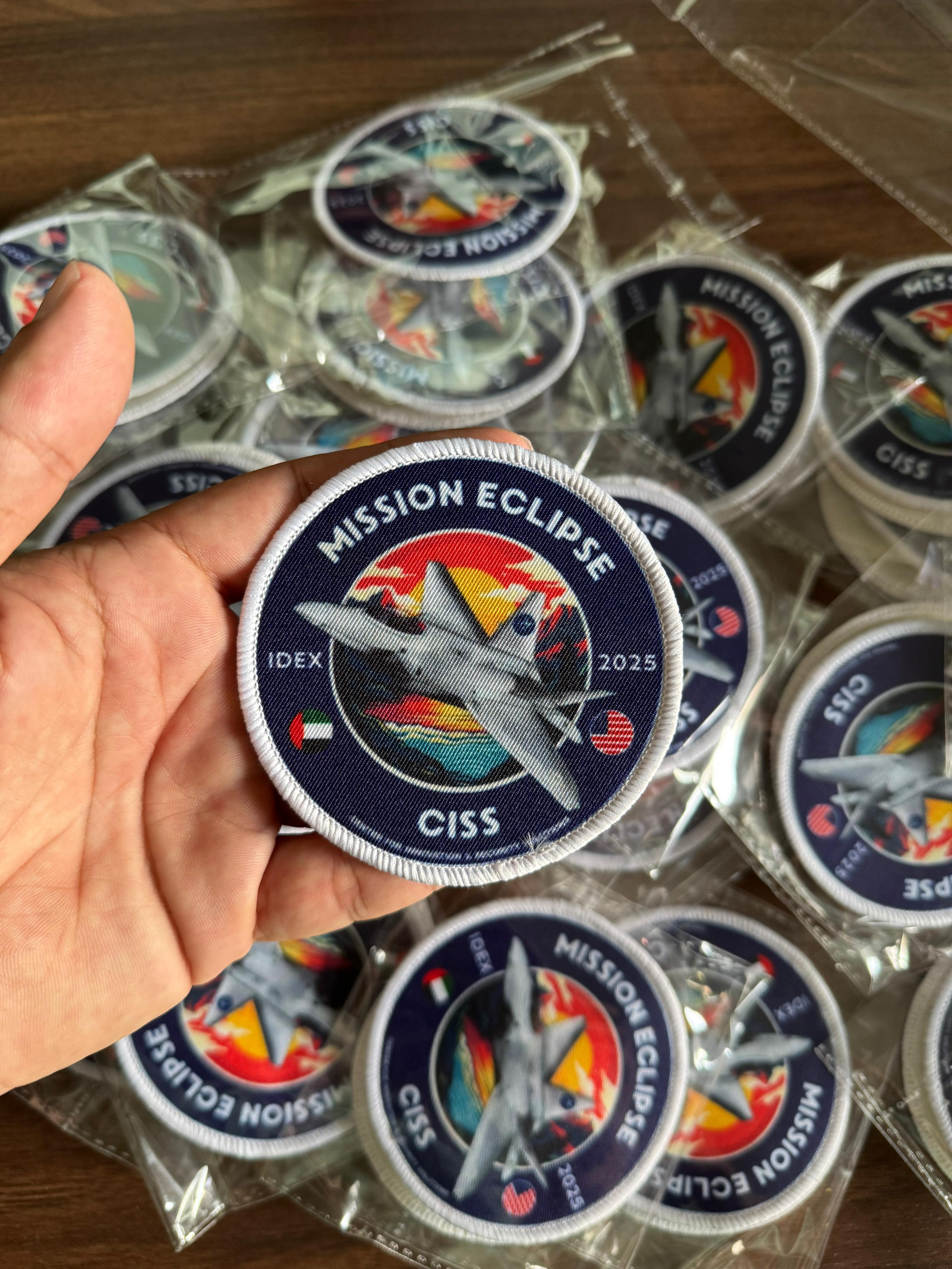 Durable printed fabric patch featuring Mission Eclipse aircraft design with fine details and vibrant colors.